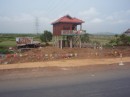 We saw many houses like this on the road between Phnom Penh and Siem Reap, with ladders hanging down from the front porch