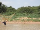 net fisherman on the riverbank 