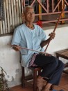 this man was playing the Cambodian version of the violin, made with a coconut gourd