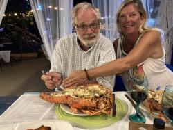 Greg and Diane enjoy the grilled Lobster at Paradise Beach Club, Carriacou