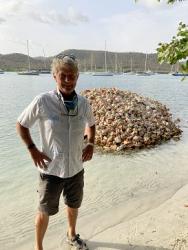 By a conch pile, at Hog Island, on the South side of Grenada