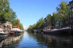 Amsterdam canal: This is a scene down one of the city’s numerous canals. The barges that you see down each side are houseboats more or less permanently fixed to the canal wall and someone’s home. 