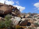 Granite Boulders : Our friend Jim rock climbing over to the hidden beach at Playa Bonanza