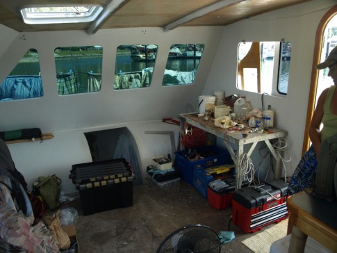 The "before" shot of the aft, port corner of the cabin where the refrigerator and "lounge" will go.