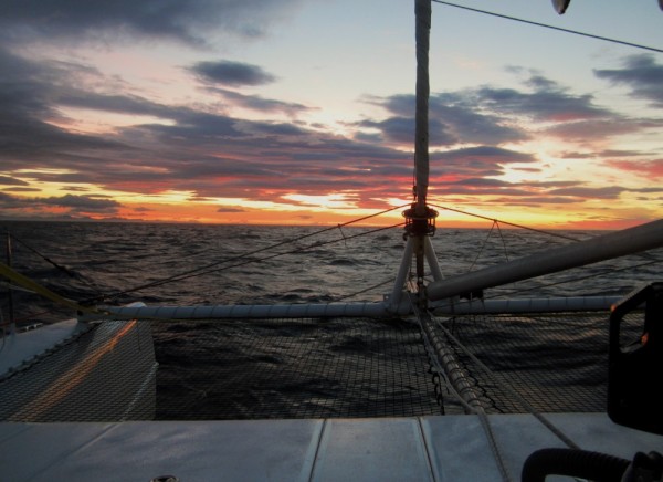 Land in sight at sunrise on day 34. Kodiak Is. can be seen just over the port bow.