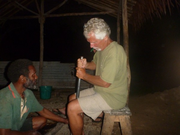 Tom grinding Kava - the local peppery drink that numbs your mouth.