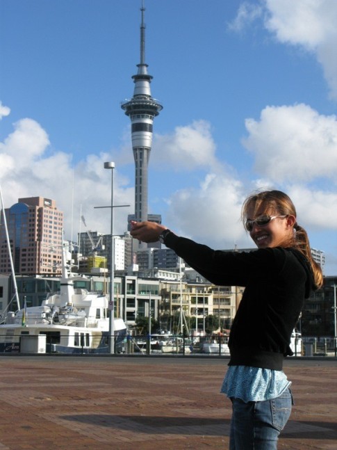 Cammi holding the Sky Tower in Auckland