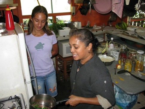 Tess teaching Southern Indian cooking to Cammi at Crows Nest Cafe
