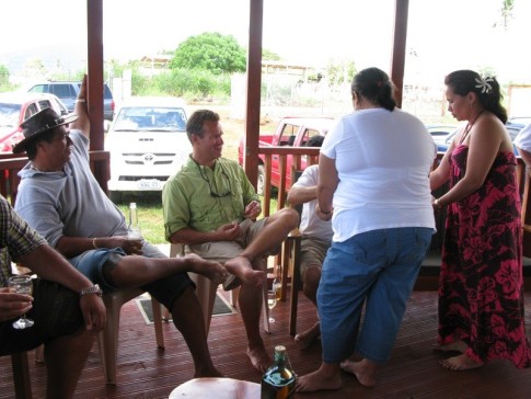 Jesse and Tom getting served appetizers by the ladies - Upolu, Samoa