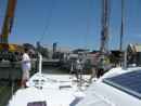 Mast being lowered onto Zen via Atlas Crane at Friendship Yachts