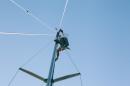 Dan on top of mast repairing Windex