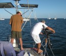 Dan hustling the outboard off the boat with Mike