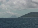 Bora Bora visible under the clouds enroute to Taha