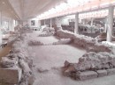 Akrotiri. Further excavation may reveal finely craved stone foundations under aggregate stone walls.