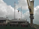Libertad on deck of Pac Adara, no sling, crane hooking up to chainplates.