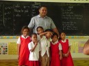 Mosese, the teacher, with the younger ones that came to school that day