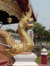 Wat Phra Singh: Intricately adorned dragon v. dragon stair railing.