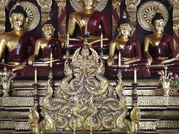 Closeup of gilded Buddha altar