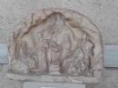 votive reliefs such as this and sculptures were displayed along one side of the stoa