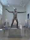 National Archaeological Museum -2 meter bronze statue of Zeus or Poseidon -he may be throwing a thunderbolt (Zeus) or he may be throwing a trident (Poseidon); from 460 BC. Dennis reading every statue