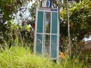 phone booth (phone torn out) in Boca Chica; everyone has cell phones (except us)