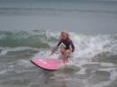 Olivia surfing in Mooloolaba