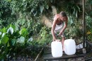 Leon filling our water cans from the mountain water in Paraty