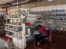 Juanita Ibarra working on her decorative ceramic tile