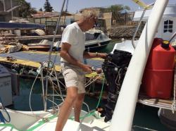 Working on the outboard.  : Haven’t used it in over a year.  The last time was when we were at anchor in Opua.