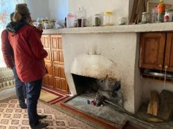 Kemir took us to his mother’s summer home.  Diane is looking at the stove/oven.