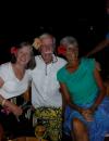 Night on the town with Joan and Mike.  Eric was busy chatting.: Octopus Resort.  Wearing our sulus while watching a MEKE, traditional singing and dancing.