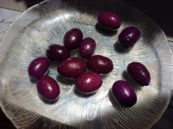Purple Olives,  a variety of Kalamata. Generally bigger than regular black olives.