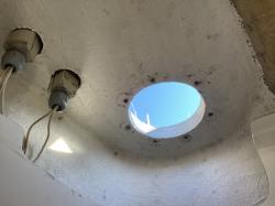 Bathroom ceiling with hole for winch.