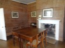 Dining Room, all local wood. Walls left bare until later years when they were wallpapered over