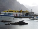 Big interisland ferry against the rugged coast at Puerto San Nicolas, Gran Canaria