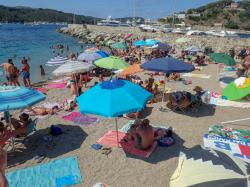 Busy beach Porto Azzurro