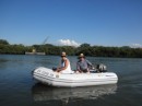 Reg & I in the dinghy heading up river
