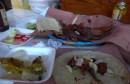 Our lunch, beef, pork, sausage with tortillas, radishes, cucumbers, grilled onions, hot peppers, on and on