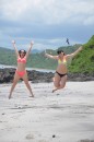 Jump pic of Alia & Emma on the island beach