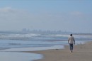 Strolling along Imperial Beach with San Diego in the background