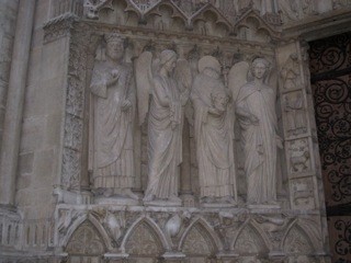 St. Denis is the headless one (he walked around w/ his head cut off guaranteeing him sainthood)