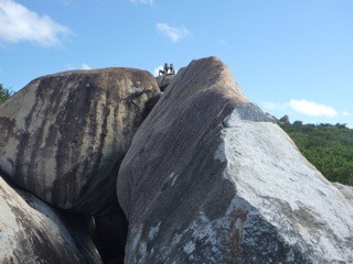 RJ and Leo climbing rocks at the Baths in the BVIs