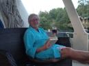 Reading a book, and a glass of wine!: A first for Susan on the boat. Showered, and leisure time with a book! Hope she gets more evenings like this.