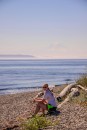 Lisa on Blake Island pebble beach with Mount Rainier.