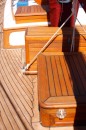 This shows the two forward hatches and the deck box stripped of varnish and refinished with Starbright.  It also shows the newly rescrewed, replugged, and recaulked teak decks.