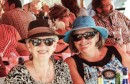 Two ladies with hats and sun glasses