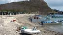 Our dinghy in foreground with fishermen pangas and huts