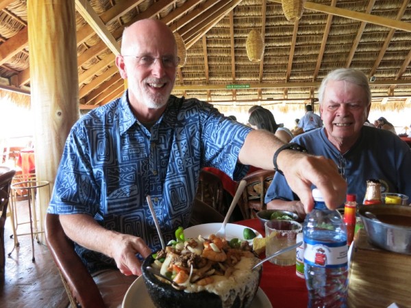 Bob and Peter show us the molcajete with shell fish and meats to share...umm..