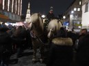 Horses pull post carriages through the old town