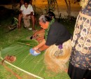 The preparation of coconut cream for cooking is a daily task here on Utulei